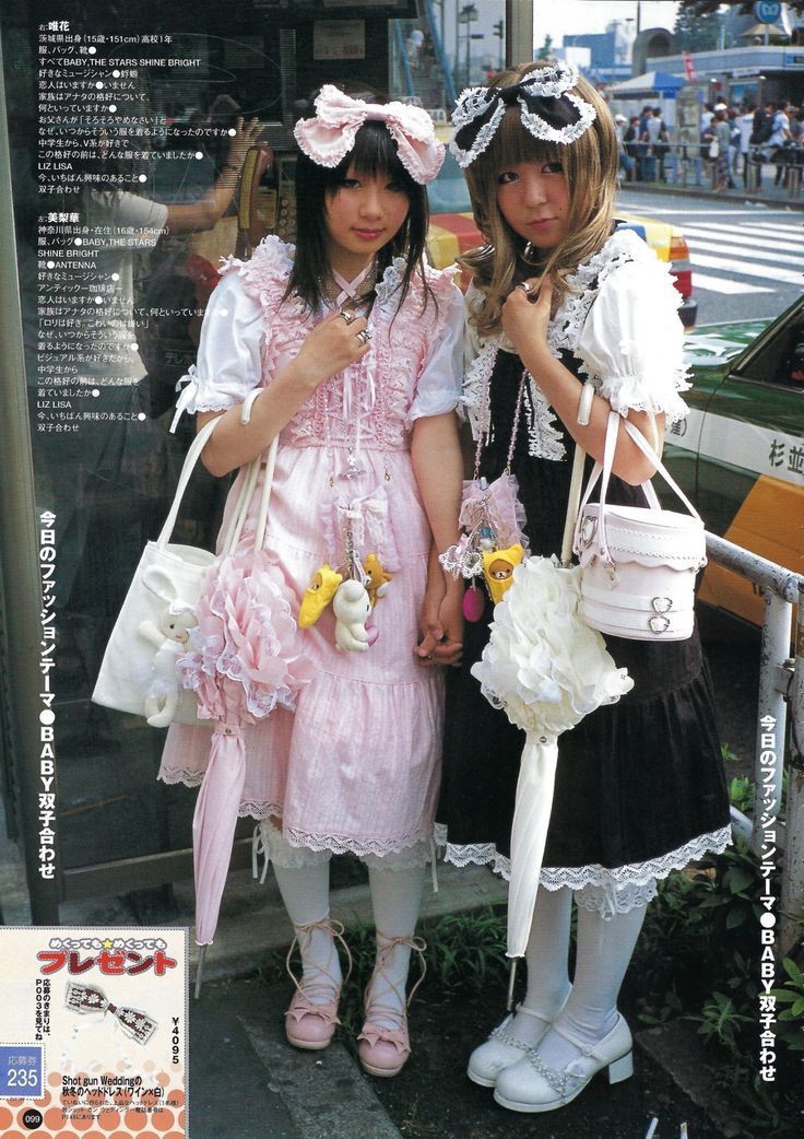 Old school Lolitas, one in pink and white, the other in black and white