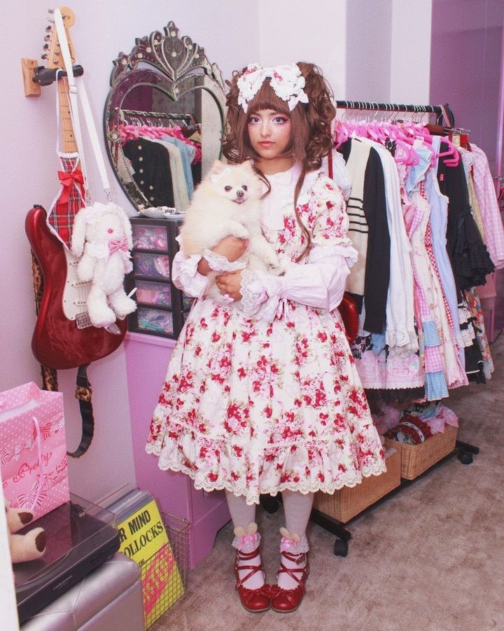A sweet Lolita with her dog in her cute room