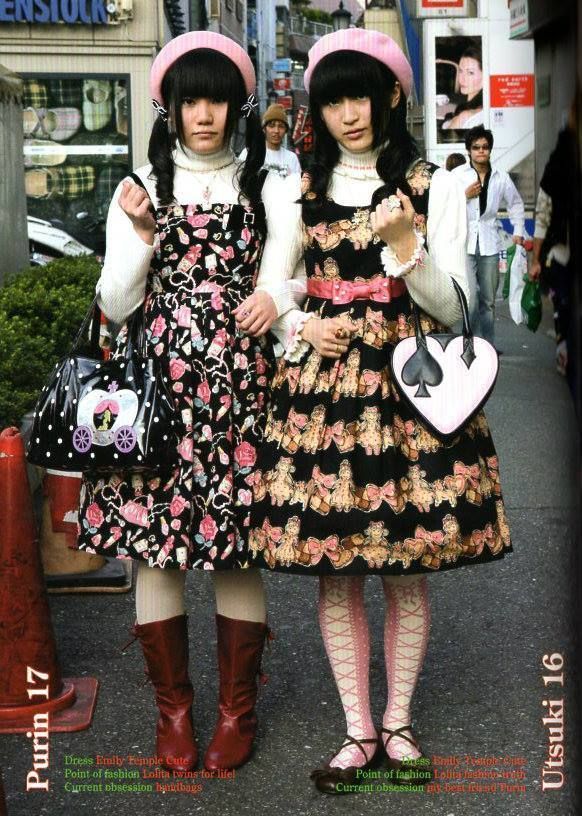 Two lolitas wearing black colour-way dresses