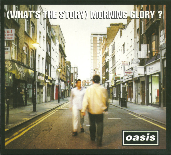 oasis CD, two men walking towards each other in London